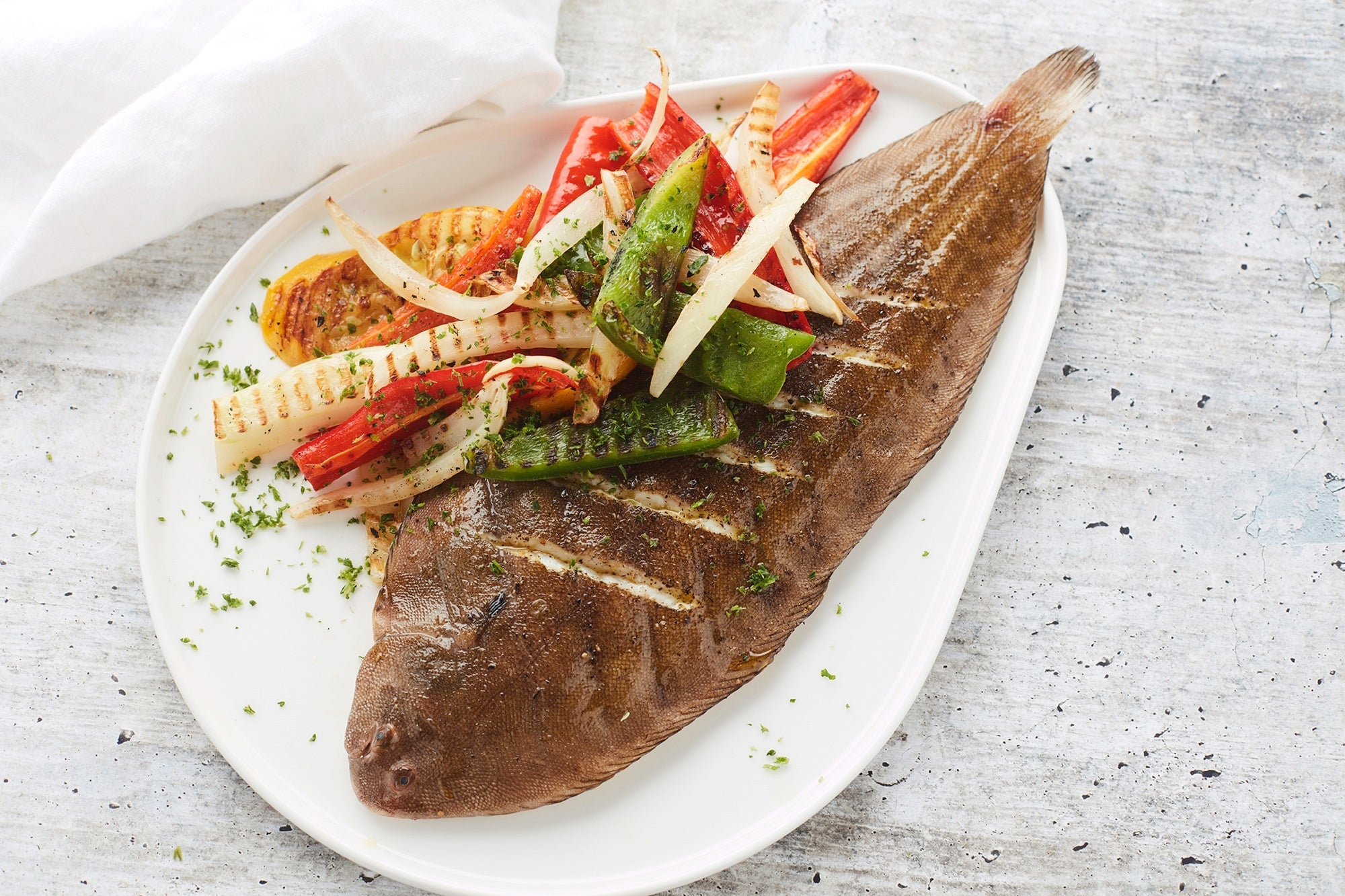 Grilled sole fillet with vegetables on the BBQ